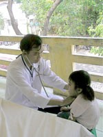 Dr. Phong examines his patient Dr. Phong examines his patient