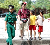 Tourist protection force led tourists to cross a road