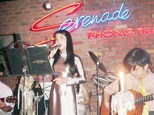 A singer performs at a decent bar in Ho Chi Minh city. A singer performs at a decent bar in Ho Chi Minh city.