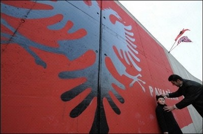 Kosovo Albanian next to a giant Albanian flag near Pristina. (AFP Photo) Kosovo Albanian next to a giant Albanian flag near Pristina. (AFP Photo)