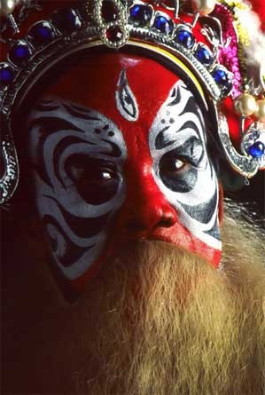 Faces of hat boi actors are always masked or colorfully painted Faces of hat boi actors are always masked or colorfully painted