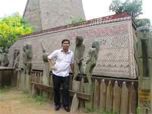 Mr. Nguyen Van Hai stands by a charnel house Mr. Nguyen Van Hai stands by a charnel house
