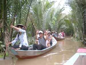 Country girls row visitors to a residential village of the Thai Son Island Country girls row visitors to a residential village of the Thai Son Island