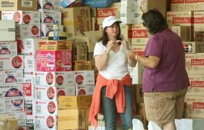 Volunteers chat next to boxes of donated goods at the Whittlesea relief centre, some 80 km north of Melbourne on Feb. 13 as Australians donate clothing, food and money in large numbers for the survivors of the bushfires (Photo: AFP) Volunteers chat next to boxes of donated goods at the Whittlesea relief centre, some 80 km north of Melbourne on Feb. 13 as Australians donate clothing, food and money in large numbers for the survivors of the bushfires (Photo: AFP)