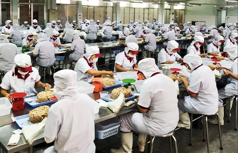 Doanh nghiệp Vissan sản xuất thực phẩm chế biến sẵn. Ảnh: HOÀNG HÙNG