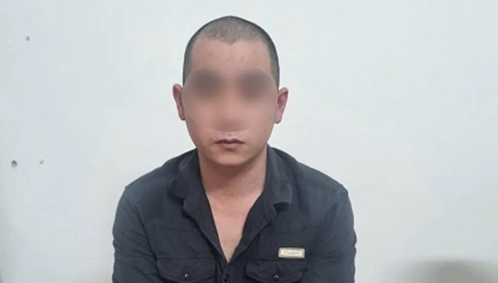 Đặng Văn S. tại cơ quan công an. Ảnh: CACC DangVanSang-blur.JPG