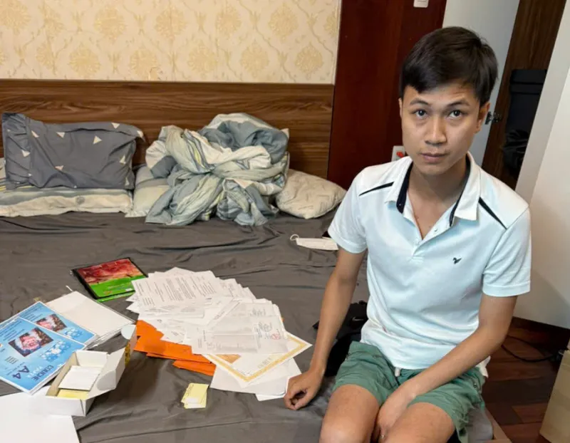 Nguyễn Văn Tình và tang vật 1000027504.jpg