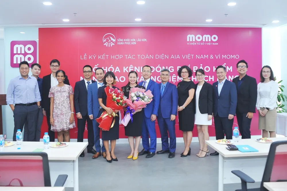 Ví MoMo và AIA hợp tác toàn diện và triển khai kênh thanh toán chiến lược  ảnh 1