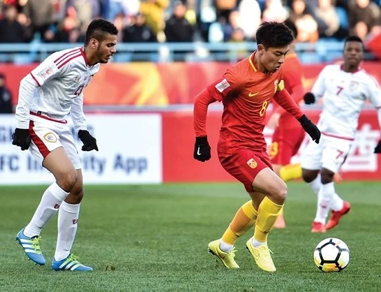 Đội Trung Quốc (áo đỏ) giành chiến thắng 3-0 trước Oman (AFC)