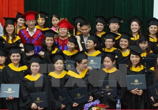 Graduates from University of Languages and International Studies under National University Hanoi at a graduation ceremony. ​(Source: VNA)