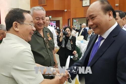 Prime Minister Nguyen Xuan Phuc attends the get-together to celebrate  the 50th anniversary of the Tet Offensive in Spring 1968.  (Photo: VNA)