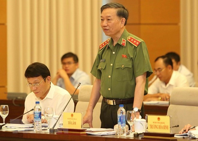 Minister of Public Security To Lam speaks at the question and answer session of the 14th National Assembly Standing Committee on August 13 (Photo: VNA)