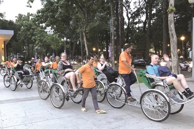 Foreign visitors in HCMC. (Photo: VNS)