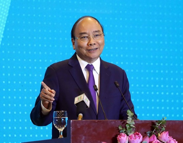 Prime Minister Nguyen Xuan Phuc addresses the “Hanoi 2020 – Investment & Development Cooperation” conference on June 27 (Photo: VNA)