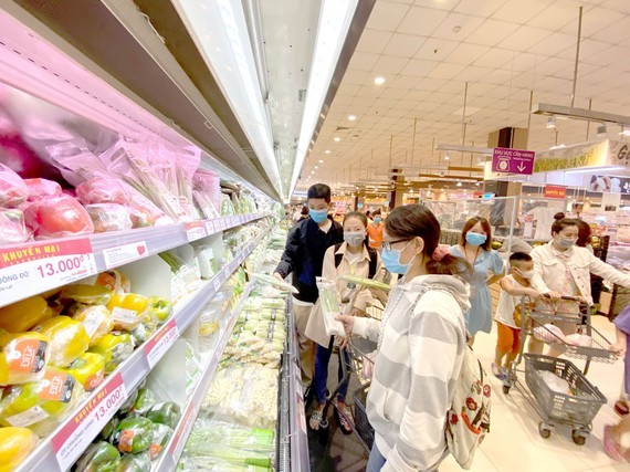 Vietnamese customers are shopping in Aeon Mall Tan Phu in HCMC.