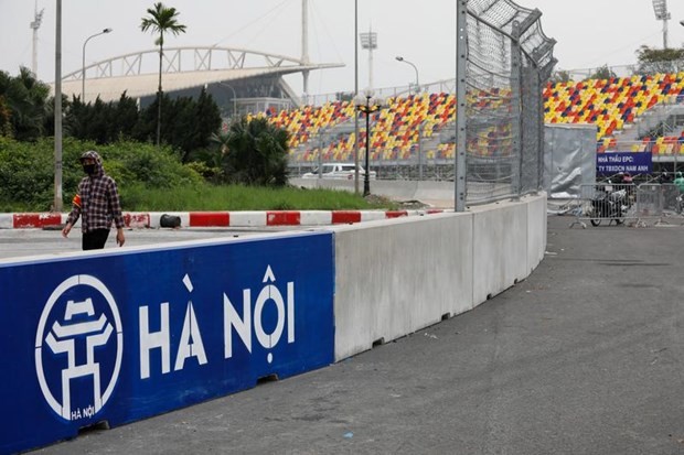 A man wears a protective mask as he guards at the construction site of Formula One Vietnam Grand Prix racing track in Hanoi, Vietnam March 12, 2020. (Photo: Reuters)