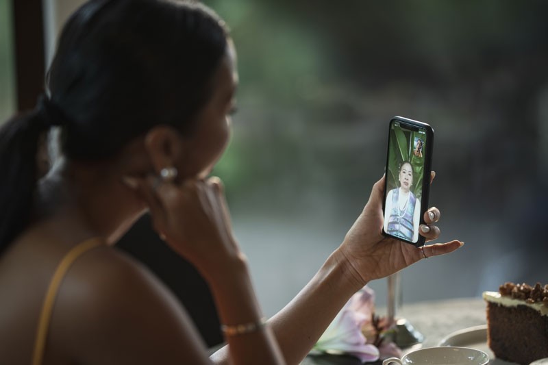 Model, actress Bang Lang makes a phone call with her mother in Vietnam during the COVID pandemic.