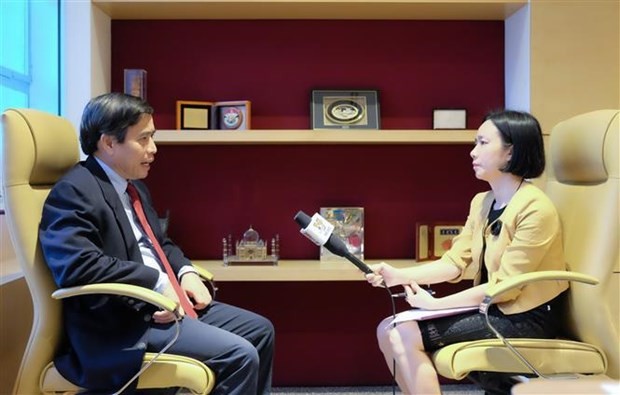 Associate Professor Vu Minh Khuong from the Lee Kuan Yew School of Public Policy in an interview with Vietnam News Agency (Photo: VNA) Associate Professor Vu Minh Khuong from the Lee Kuan Yew School of Public Policy in an interview with Vietnam News Agency (Photo: VNA)