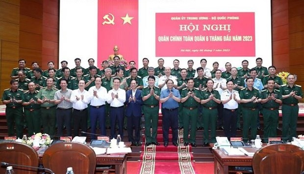 Prime Minister Pham Minh Chinh (front row, seventh from right) and delegates at the political-military conference of the army in Hanoi on July 5 (Photo: VNA) Prime Minister Pham Minh Chinh (front row, seventh from right) and delegates at the political-military conference of the army in Hanoi on July 5 (Photo: VNA)