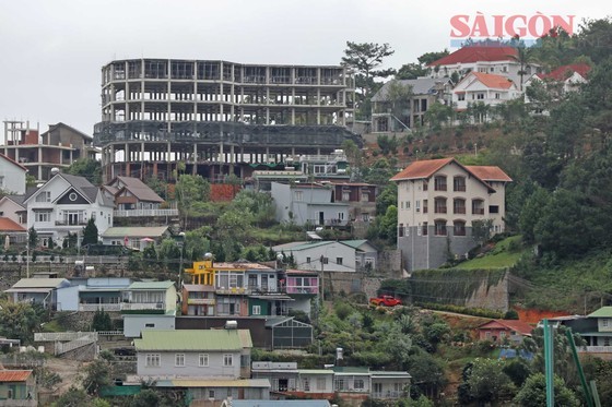 Big buildings on a hill are under construction. Big buildings on a hill are under construction.