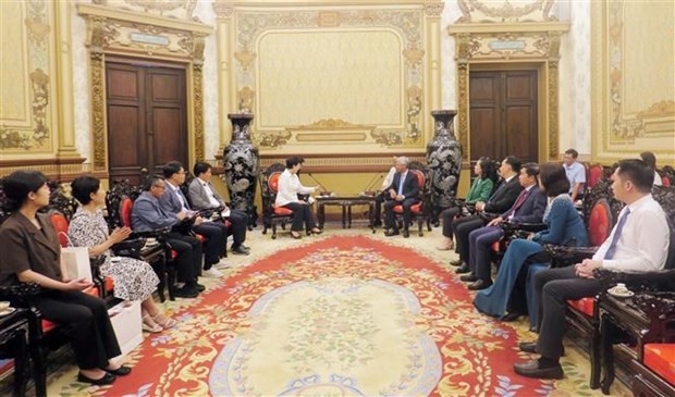 At the working session (Photo: VNA)