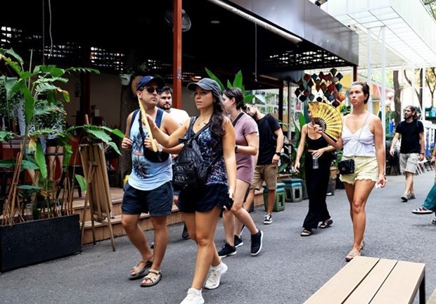 Spanish tourists visit Book Street in Ho Chi Minh City. (Photo: VNA)
