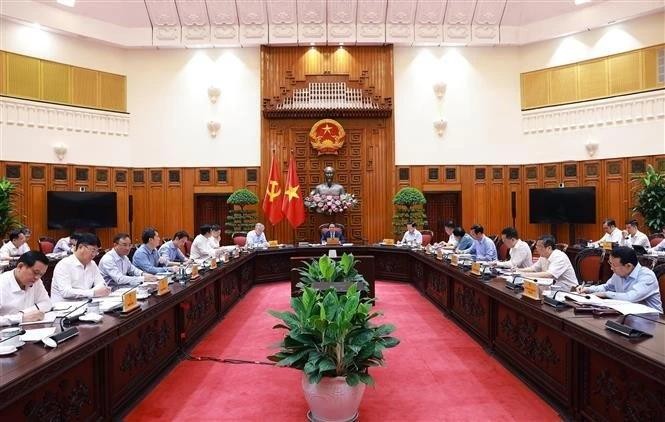 At the exclusive meeting to seek solutions to the US's new tariff policy, chaired by PM Pham Minh Chinh in Hanoi on May 6. (Photo: VNA) prime-minister-pham-minh-chinh-vietnam-us-trade-negotiations-us-reciprocal-tariff-policy-vna.jpg