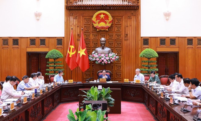 At the meeting on May 10 (Photo: VNA) vna-potal-thu-tuong-chu-tri-cuoc-hop-thuong-truc-chinh-phu-ve-trung-tam-tai-chinh-quoc-te-8024377.jpg