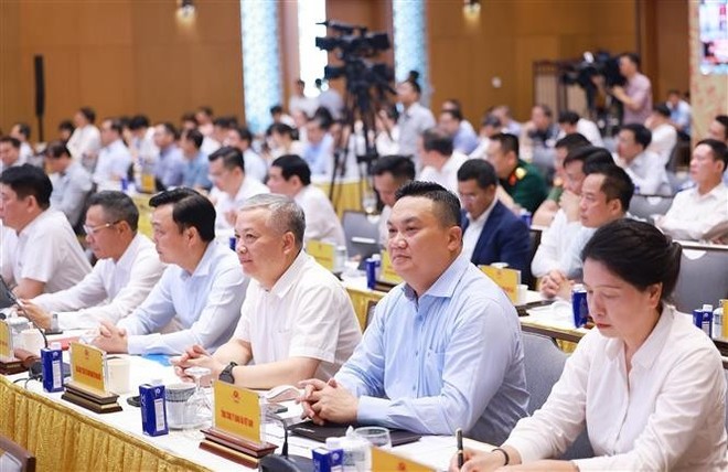 Participants at the online national conference on boosting public investment as a key driver of economic growth in 2025. (Photo: VNA) dai-bieu.jpg