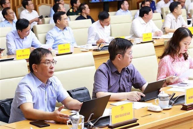 Participants in the meeting at the Government's headquarters in Hanoi on June 22 (Photo: VNA) pm-chairs-national-teleconference-to-promote-key-programmes-2.jpg