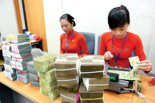 Huy động tiền gửi cuối năm lại nóng. Ảnh: LÃ ANH Huy động tiền gửi cuối năm lại nóng. Ảnh: LÃ ANH