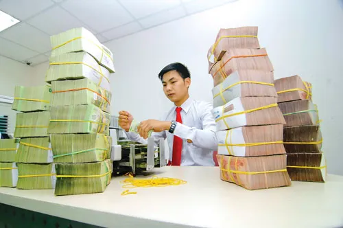 Khai thông được khối nợ xấu sẽ góp phần khai thông nguồn vốn tín dụng. Ảnh: LONG THANH