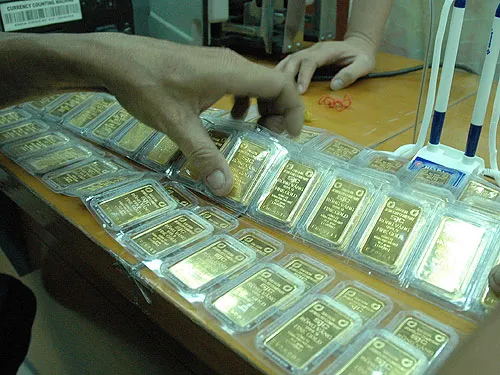 Chênh lệch giá “kích” vàng lậu ảnh 1