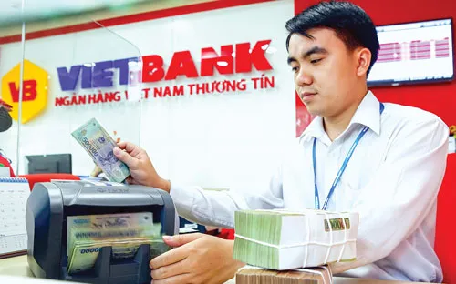 Chính sách tiền tệ 2017 tiếp tục điều hành chủ động, linh hoạt nhằm ổn định các cân đối vĩ mô và kiểm soát lạm phát. Ảnh: LONG THANH