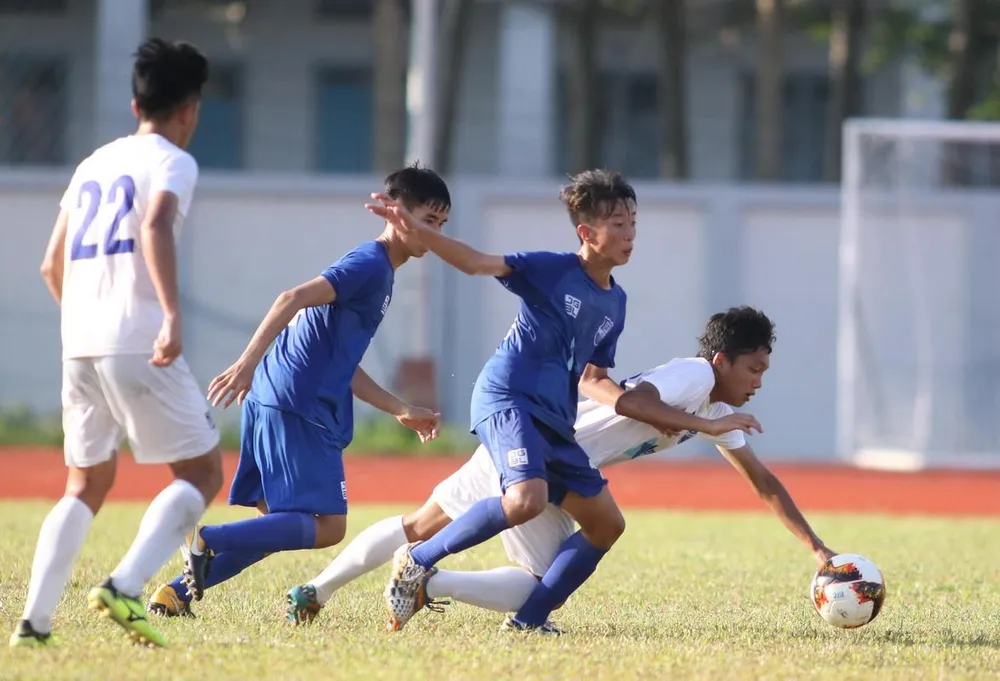 PVF (áo trắng) kịp giành vé vào bán kết sau chiến thắng 1-0 trước Bình Dương. Ảnh: ANH KHOA