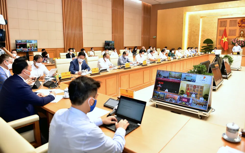 Chính phủ tháo gỡ khó khăn cho doanh nghiệp vượt đại dịch ảnh 2