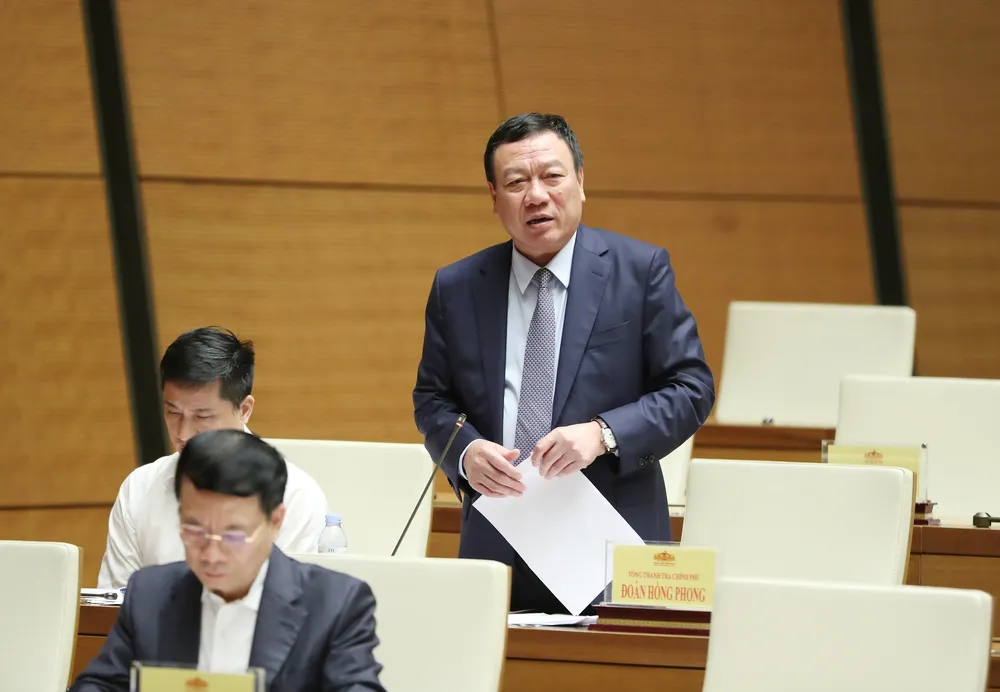Tổng thanh tra Chính phủ Đoàn Hồng Phong trả lời chất vấn. Ảnh: QUANG PHÚC