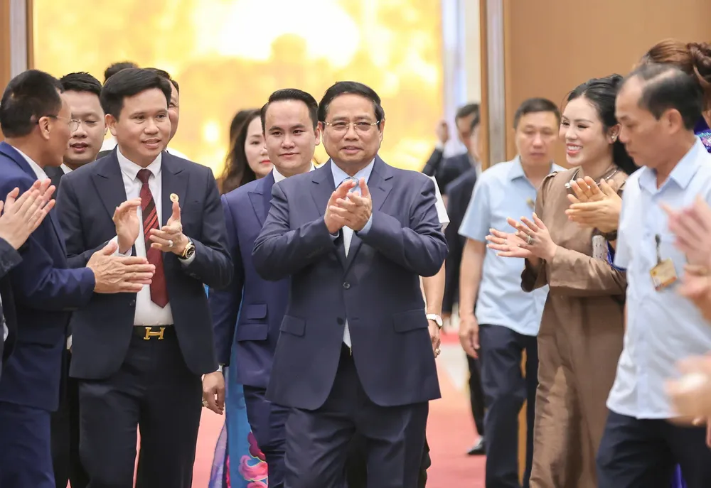 Thủ tướng Phạm Minh Chính đến hội nghị "doanh nghiệp góp phần vào tăng trưởng hai con số và Thủ tướng Chính phủ tri ân doanh nghiệp". Ảnh: VIẾT CHUNG
