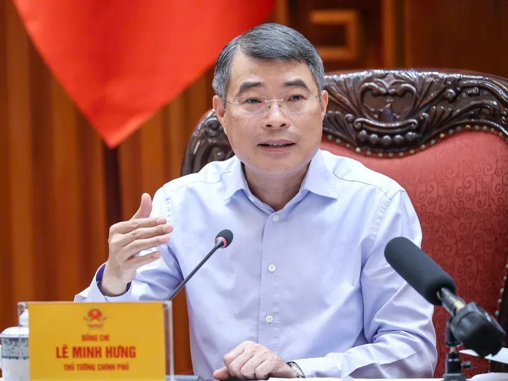 Thủ tướng Lê Minh Hưng chủ trì cuộc họp về việc tiếp tục triển khai hoạt động của Trung tâm tài chính quốc tế tại Việt Nam, chiều 2-6. Ảnh VIẾT CHUNG.jpg