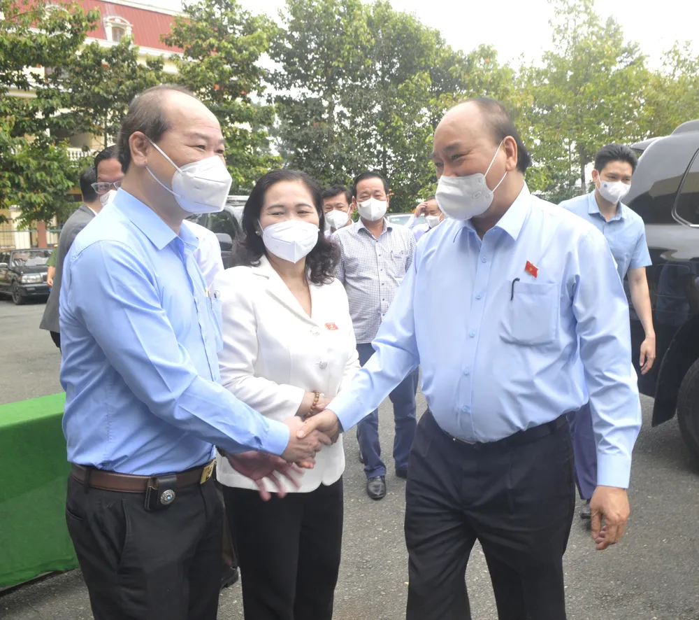 Chủ tịch nước Nguyễn Xuân Phúc: TPHCM cần lấy lại vị thế, hình ảnh trên mọi phương diện ảnh 4