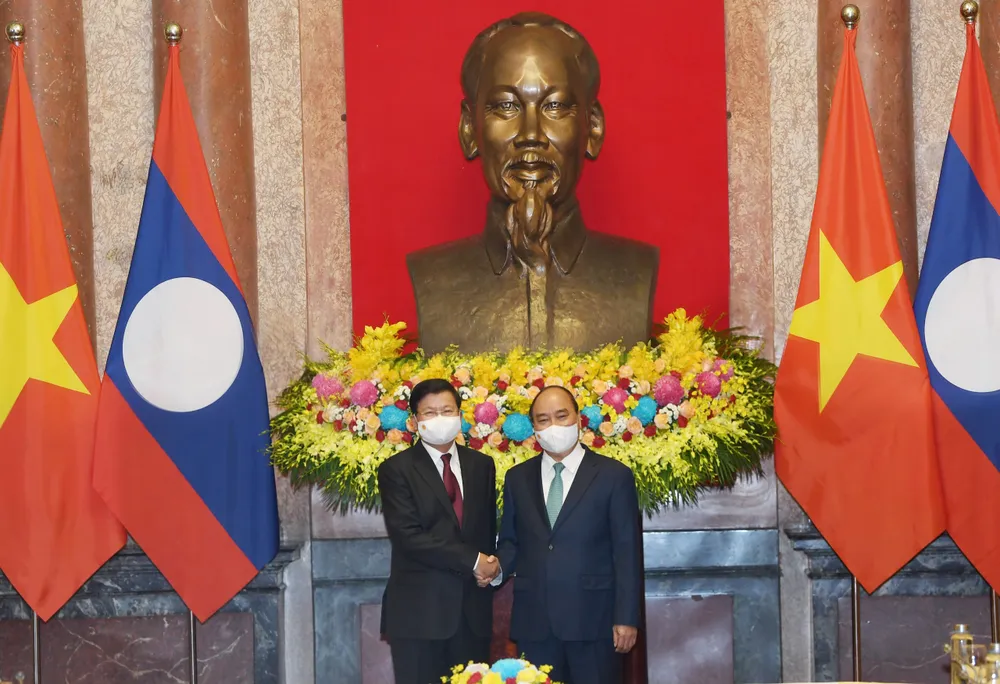 Chủ tịch nước Nguyễn Xuân Phúc hội kiến với Tổng Bí thư, Chủ tịch nước Lào Thongloun Sisoulith ảnh 1