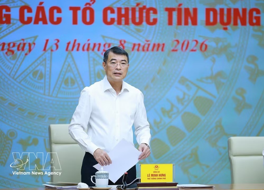 越南政府总理黎明兴主持同越南国家银行及信贷机构体系的工作会议。图自越通社