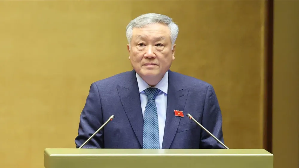 Phó Thủ tướng Thường trực Nguyễn Hòa Bình thông tin về vai trò và ý nghĩa của Trung tâm Tài chính quốc tế, sáng 11-6. Ảnh: QUANG PHÚC