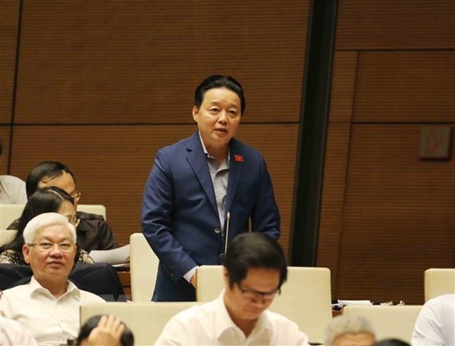 Minister of Natural Resources and Environment Tran Hong Ha at the Question-and-Answer session (Photo: VNA)