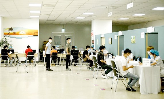 ​Businesses willing to pay for staff vaccination ảnh 1