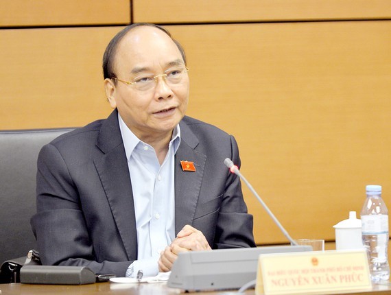 NA deputies debate laws, anti-corruption ảnh 1