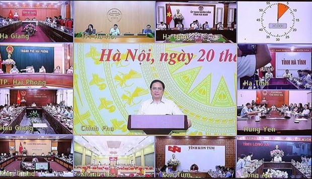 PM chairs teleconference on labour market development ảnh 1