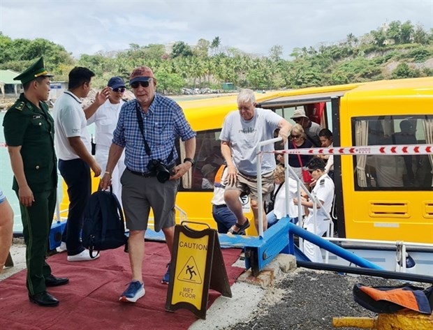Foreign tourists on an international cruise docking at the coastal city of Nha Trang, Khanh Hoa province, come on the mainland for sightseeing in March 2023. (Photo: VNA)