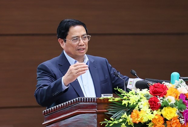 Prime Minister Pham Minh Chinh speaks at the meeting. (Photo: VNA)