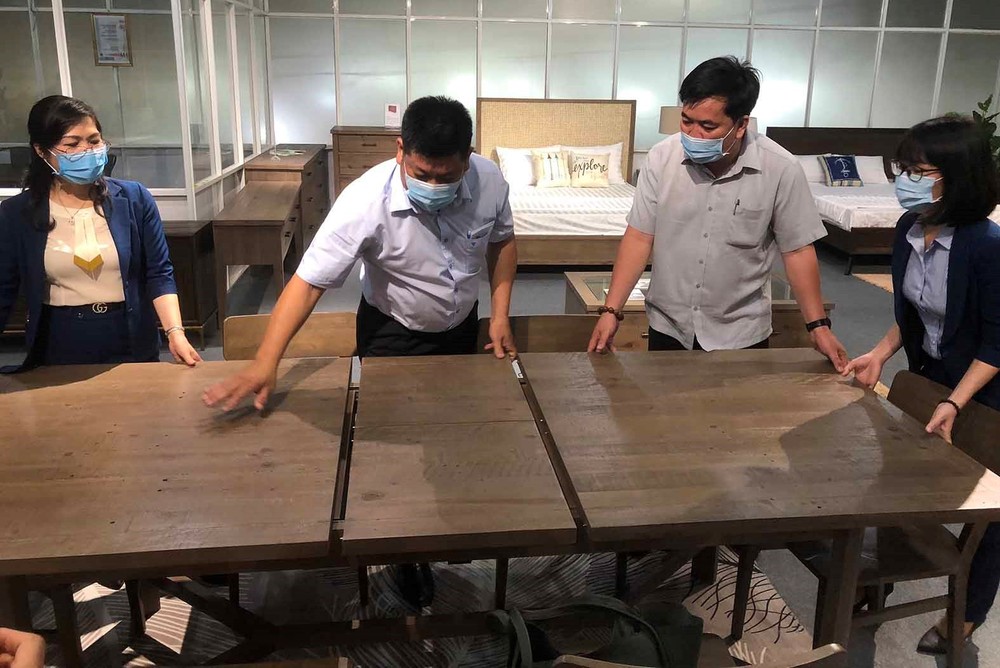 Workers of a wood company in Binh Duong are making furniture